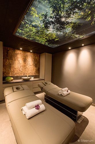 Spa treatment room with forest ceiling